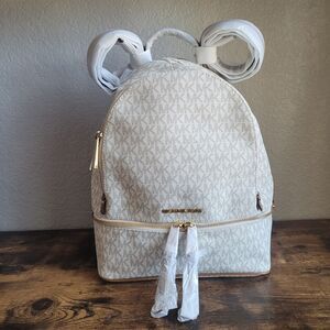 NEW Michael Kors Rhea Zip Slim Medium Backpack Vanilla Ivory Monogram Logo NWT